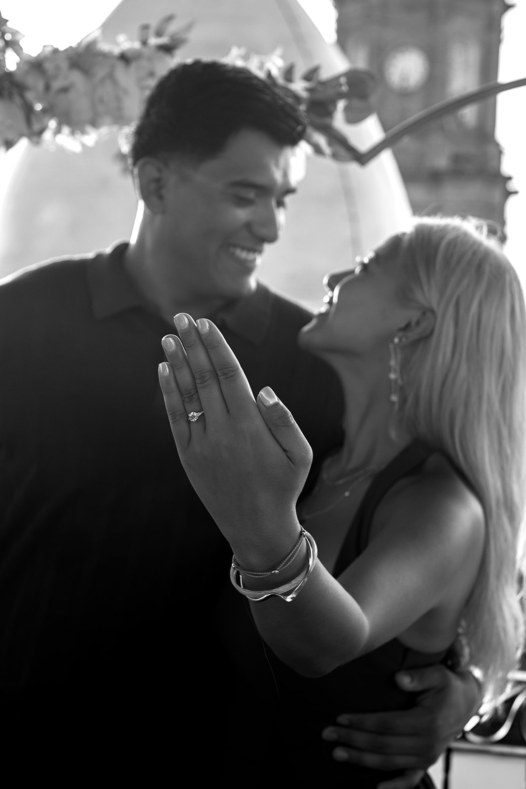 Newly engaged woman laughing and showing her engagement ring in Puerto Vallarta