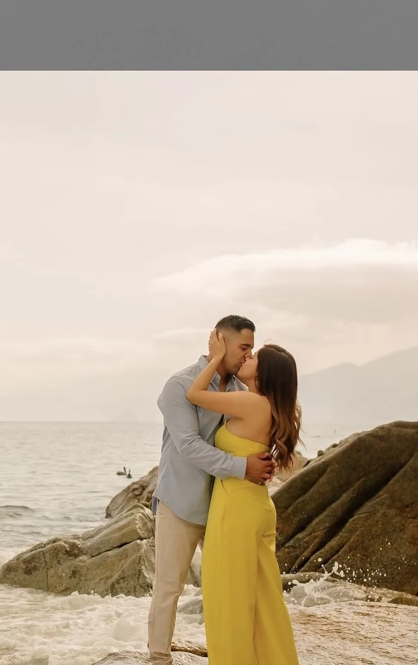 Couple on the rocks of the Romantic Zone shoreline